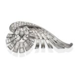 A Diamond Scroll Brooch, a central round brilliant cut diamond within a border of pear cut