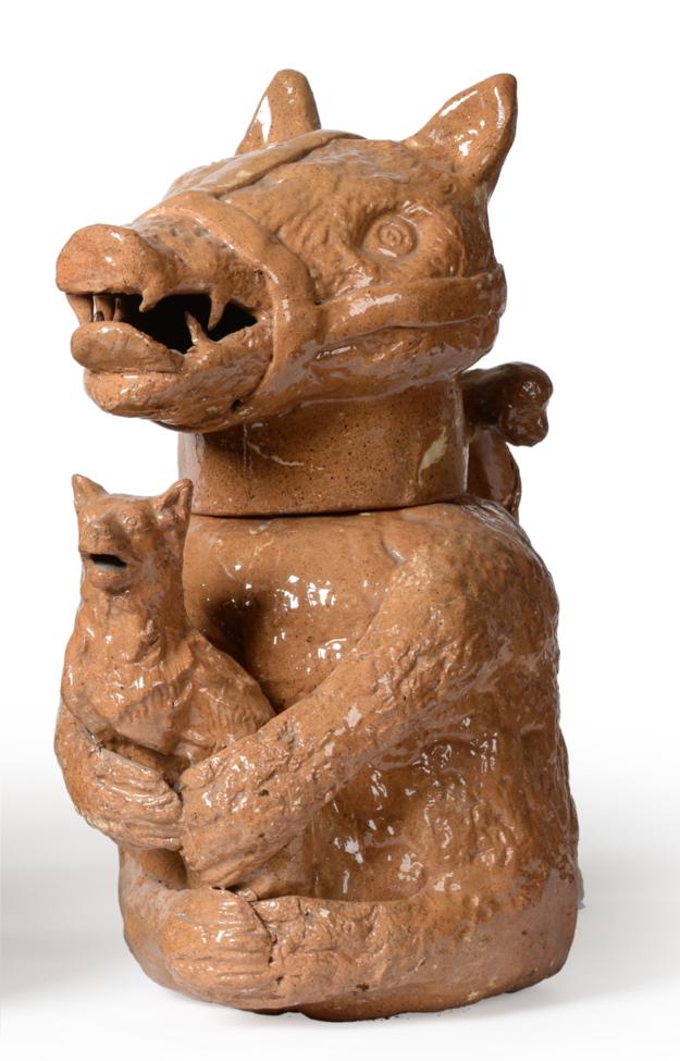 A Staffordshire Brown Glazed Pottery Bear Jug and Cover, early 19th century, naturalistically