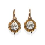 A Pair of Diamond Solitaire Earrings, old cut diamonds in yellow raised prong settings, total