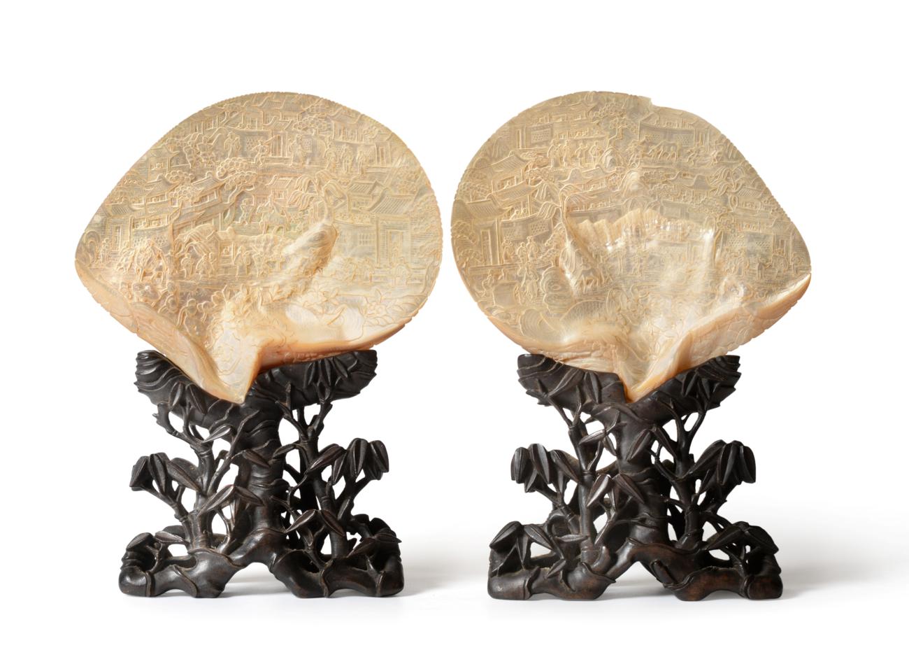 A Pair of Chinese Carved Mother-of-Pearl Shells, 19th century, each carved with figures amongst