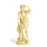 A Japanese Ivory Okimono of a Fisherman, Meiji period, in traditional dress holding a net, on a