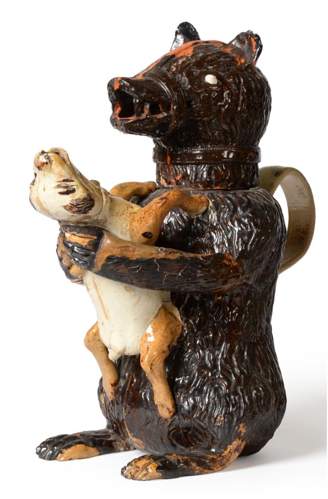 A Staffordshire Pottery Bear Jug and Cover, early 19th century, the naturalistically modelled seated