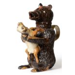 A Staffordshire Pottery Bear Jug and Cover, early 19th century, the naturalistically modelled seated