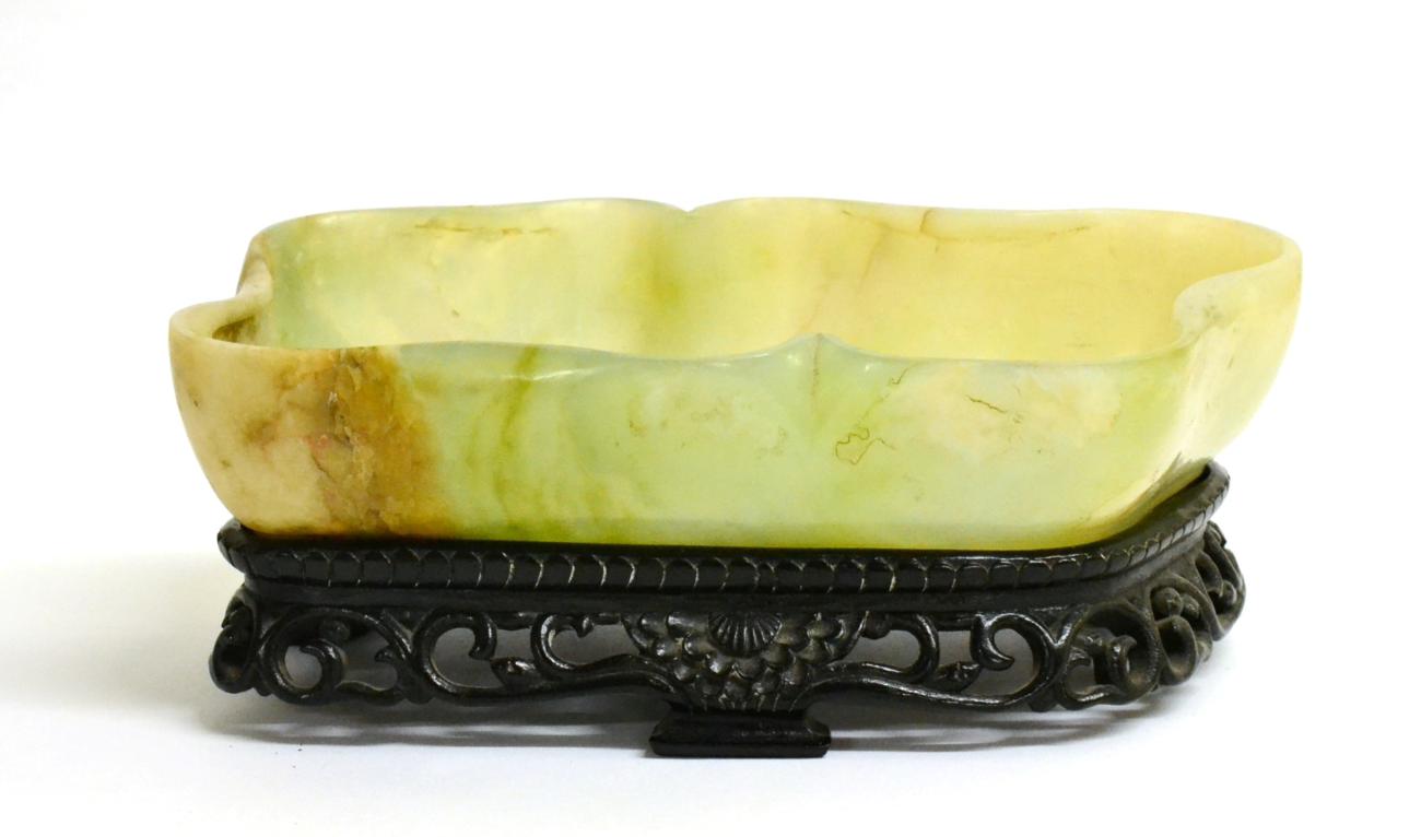 A Chinese Jade Brush Washer, of lobed rectangular form, 20cm long, on hardwood stand