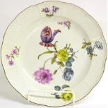 A Set of Six Meissen Porcelain Dinner Plates, circa 1755, painted with flower sprays and scattered