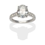 A Diamond Solitaire Ring, by Cartier, an oval brilliant cut diamond in a white claw setting, to