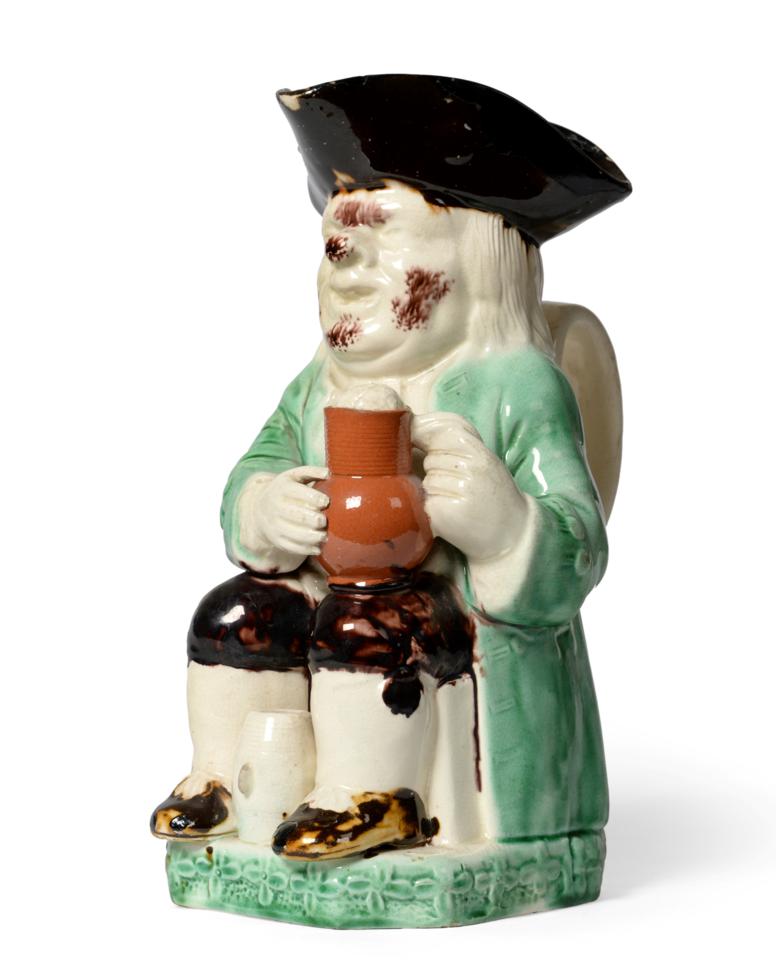 A Ralph Wood Type Toby Jug, circa 1780, of traditional form with manganese hat and green jacket
