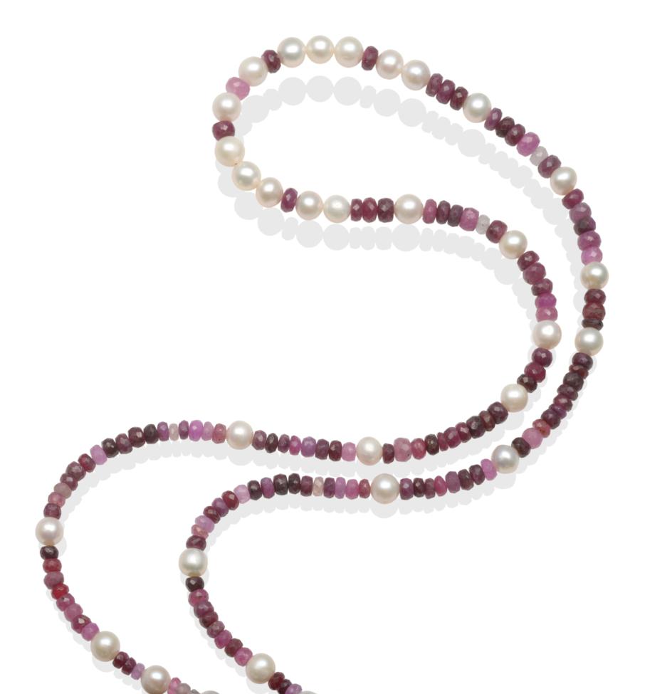 A Cultured Pearl and Ruby Necklace, cultured pearls spaced by groups of shaded faceted ruby beads of