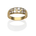 A Diamond Two Row Ring, inset with two rows of old pear cut and old mine cut diamonds to a yellow