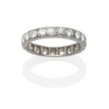 A Diamond Eternity Ring, round brilliant cut diamonds in white collet and claw settings, total