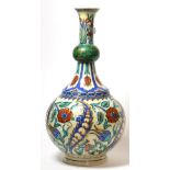 An Isnik Style Pottery Guglet, late 19th century, with garlic neck, painted in colours with stylised