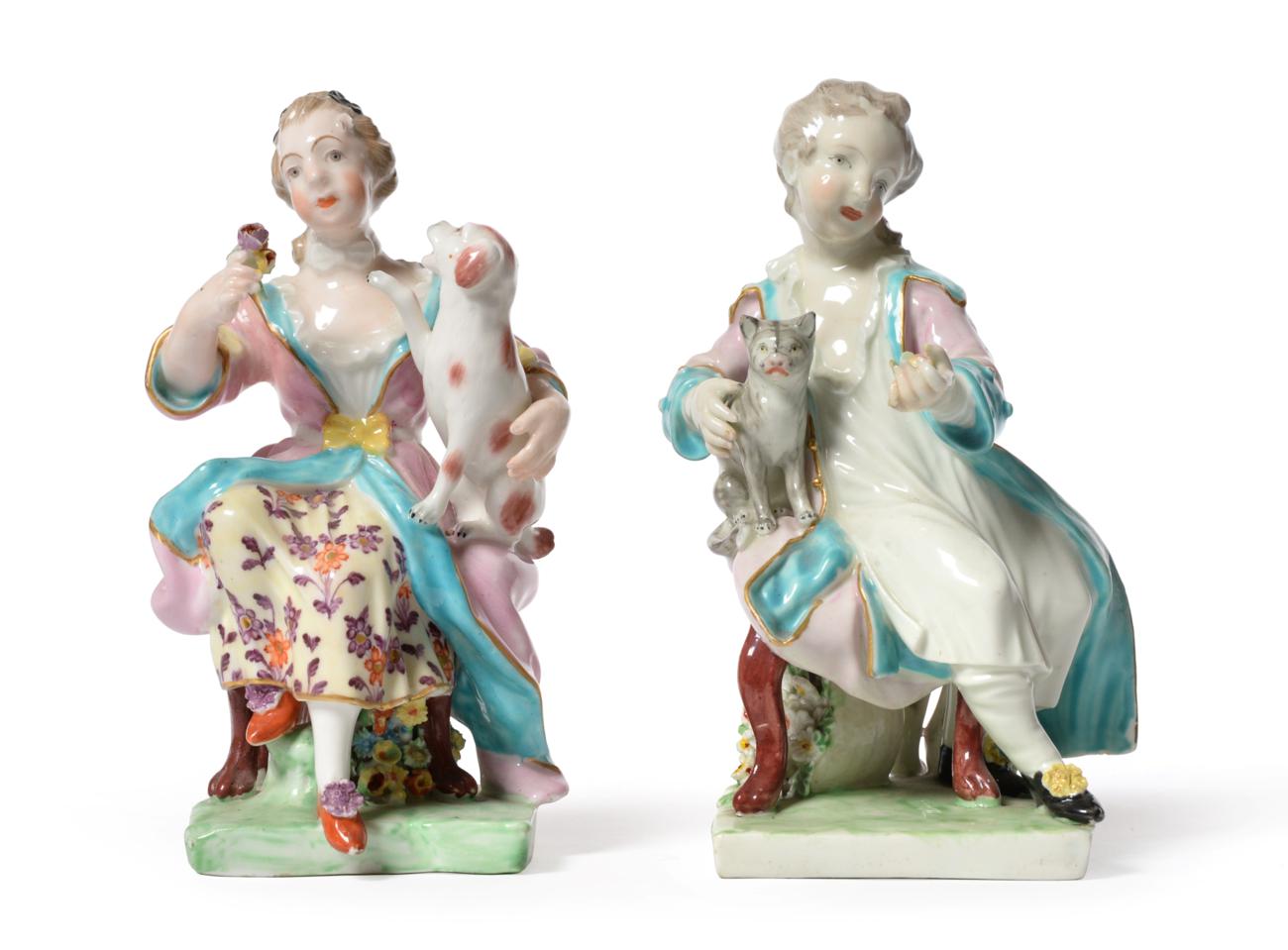 A Pair of Derby Porcelain Figures, circa 1770, as a seated boy and girl, she with a dog, he with a
