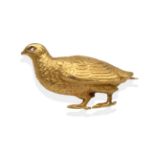 A Grouse Brooch, realistically modelled and with a rose cut diamond inset eye, measures 2.9cm by 2.