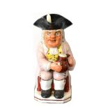 A Staffordshire Pearlware Ruddy-Faced Toby Jug, early 19th century, wearing a black hat and lilac