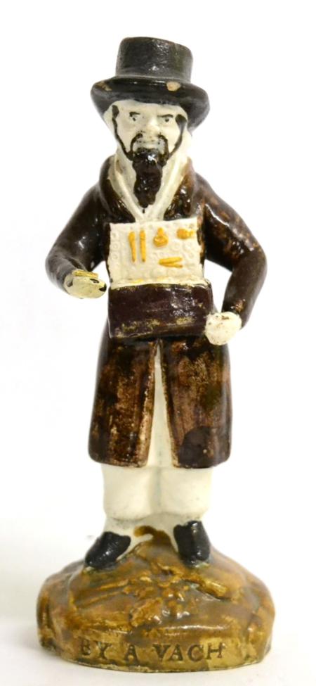 A Prattware Figure of a Jewish Pedlar, circa 1800, the bearded figure standing holding an open box