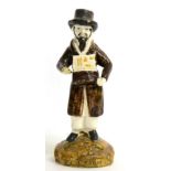 A Prattware Figure of a Jewish Pedlar, circa 1800, the bearded figure standing holding an open box