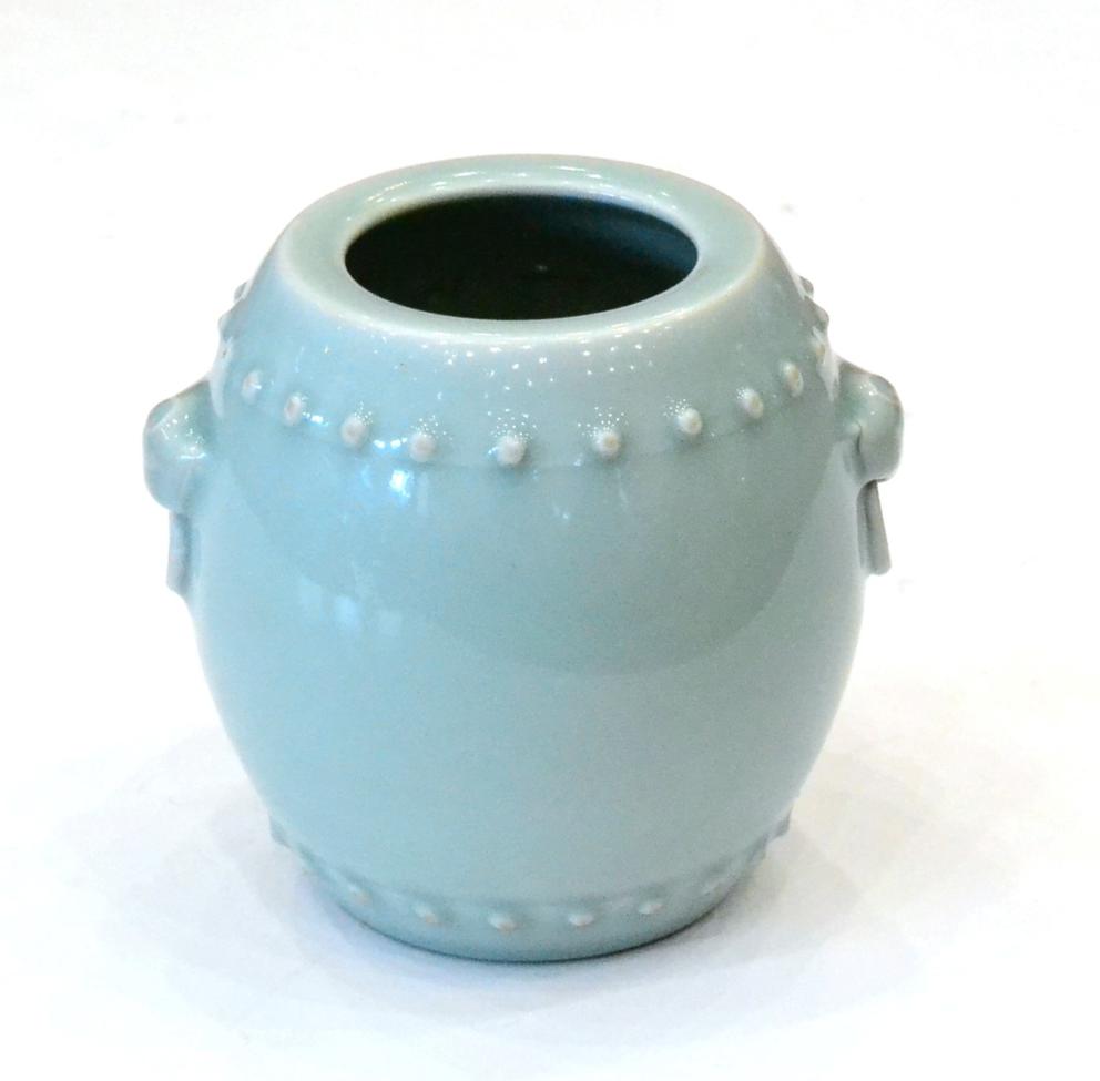 A Chinese Celadon Glazed Barrel Shaped Vase, with mask and loop handles, bears six character