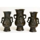 A Garniture of Three Chinese Bronze Vases, bears Xuande reign mark, of flattened baluster form