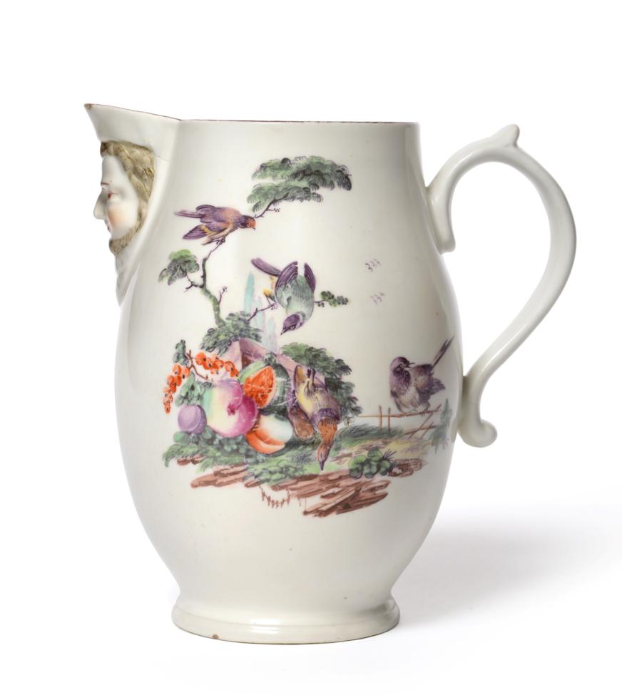 A Derby Porcelain Mask Jug, circa 1765, of ovoid form, painted with birds in fruiting branches, 16cm