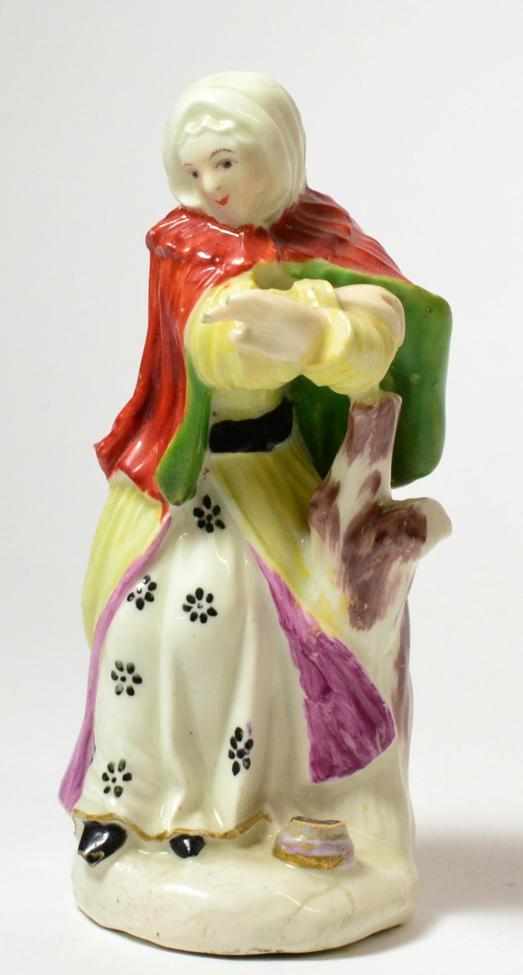 A Derby Porcelain Figure of Winter, circa 1765, from a set of The Seasons, as a lady holding her