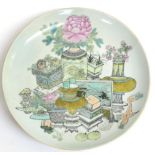 A Chinese Porcelain Charger, Qianlong reign mark but not of the period, painted in famille rose