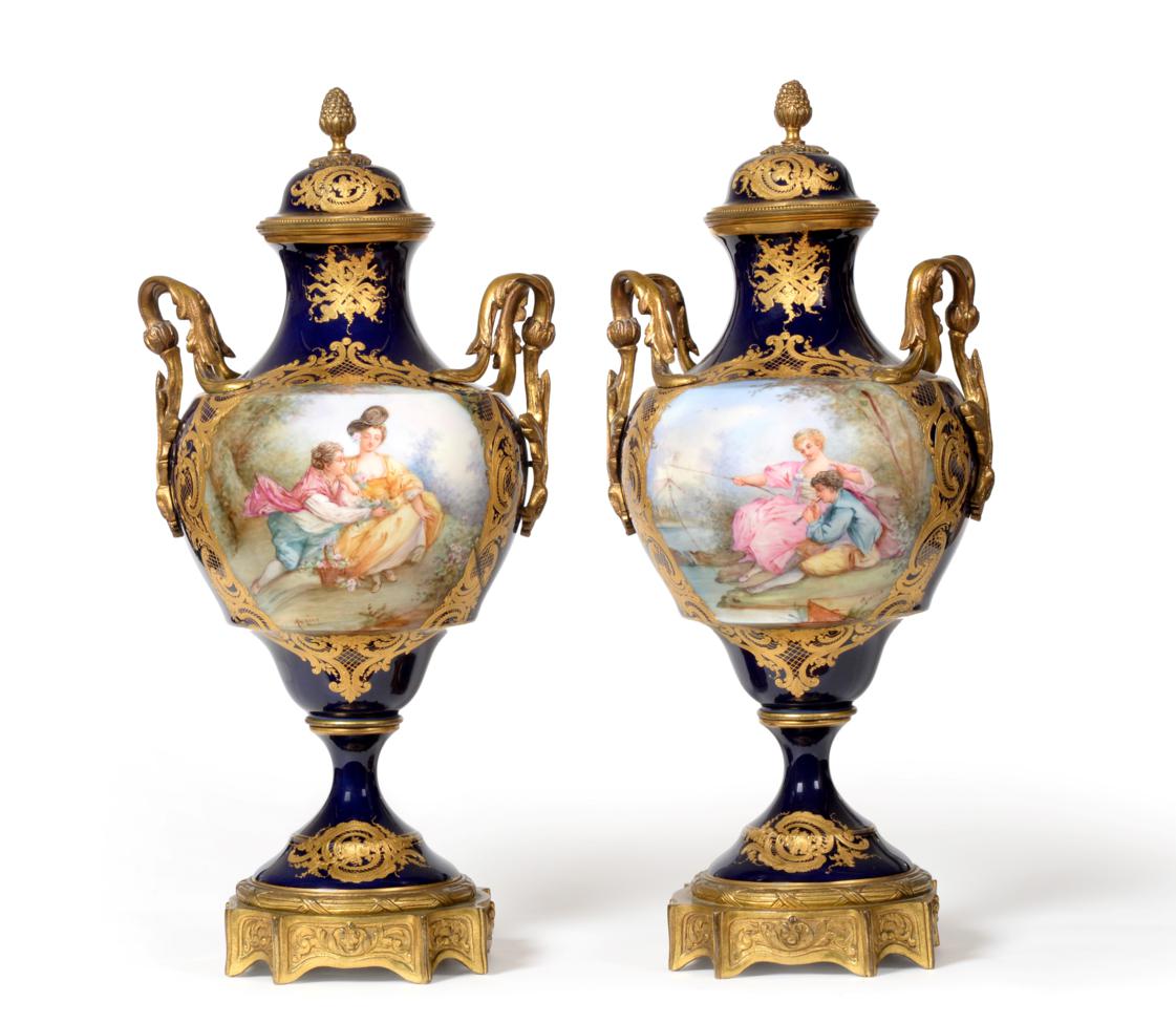 A Pair of Gilt Metal Mounted Sèvres Style Vases and Covers, 19th century, of baluster form with pine