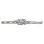 A Diamond Bracelet, with a central undulating and swirling diamond cluster, to a three row diamond