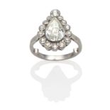 A Pear Cut Diamond Cluster Ring, an old pear cut diamond within a conforming border of graduated old