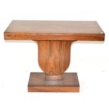 French School: An Art Deco Rosewood Console Table, the rectangular top on a shaped support, on a