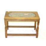 A Yorkshire School Oak Rectangular Coffee Table, the top inset with a glass panel enclosing a