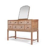 An Art Deco Limed Oak Bedroom Suite, all with geometric repeating pattern and shaped square handles,