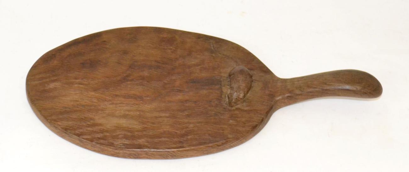 A Robert ''Mouseman'' Thompson Oak Cheese Board, circa 1948, with carved mouse signature on the
