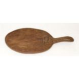 A Robert ''Mouseman'' Thompson Oak Cheese Board, circa 1948, with carved mouse signature on the