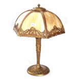 An Early 20th Century American Gilt Metal Table Lamp, with a domed mottled coloured glass