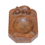 A Robert ''Mouseman'' Thompson Oak Bread Board, with carved mouse signature, 31cm; and Two