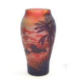 A De Vez Cameo Glass Egyptian Scene Vase, in amber shading overlaid with crimson, cut with palm
