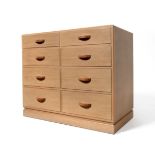 An Art Deco Rowley Oak Chest of Drawers, the rectangular top, above two short over three long