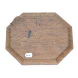 A Robert ''Mouseman'' Thompson Oak Bread Board, with carved mouse signature, 31cm