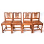 A Set of Four Robert ''Mouseman'' Thompson Oak Lattice Back Dining Chairs, with cow hide upholstered