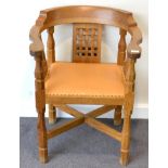 A Robert ''Mouseman'' Thompson Oak Monk's Chair, with curved back and shaped arms, over three