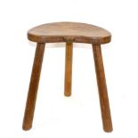 A Robert ''Mouseman'' Thompson Oak Cow Stool, on three legs, with carved mouse signature on seat,