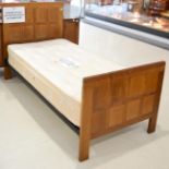 A Robert ''Mouseman'' Thompson Oak 3ft Single Panelled Bedstead, the panelled headboard and