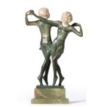 E Pucher (Austrian): A Patinated Bronze and Ivory Group, circa 1925, modelled as two young girls