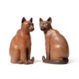Stan ''Woodpecker'' Dodds (1928-2012): Two Carved Siamese Cats, both seated, with blue painted eyes,