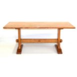 An Alan Grainger Acorn Industries Oak Rectangular Coffee Table, on two shaped supports, joined by