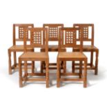 A Set of Five Robert ''Mouseman'' Thompson Oak Lattice Back Dining Chairs, on two octagonal front