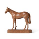 Stan ''Woodpecker'' Dodds (1928-2012): A Carved Thoroughbred Race Horse, on a shaped rectangular