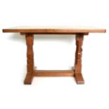 A Robert ''Mouseman'' Thompson Oak 4ft Dowelled Top Side/Extension Table, on two octagonal legs