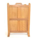 A Robert ''Mouseman'' Thompson Oak Firescreen, with four solid panels ending at floor level with two