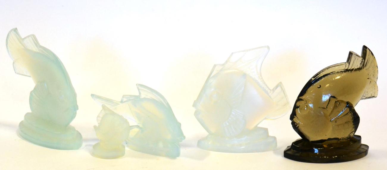 A Sabino Smokey Glass Fish, etched Sabino France, 11cm; and Four Sabino Opalescent Glass Fish,